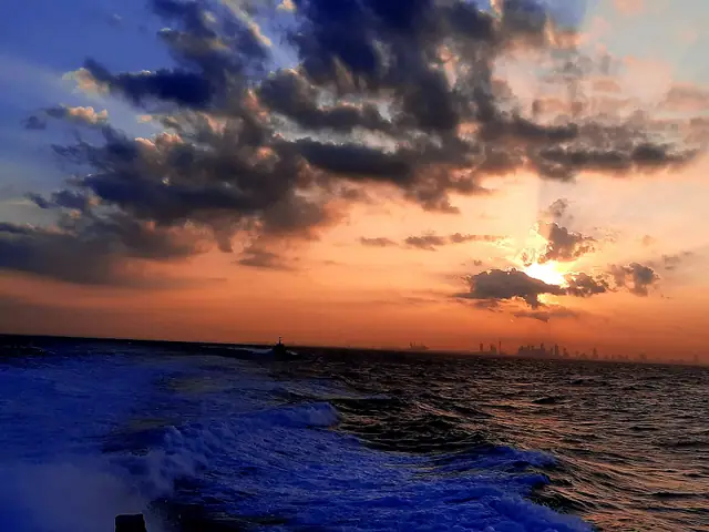 Sunrise over the Colombo skyline from the sea